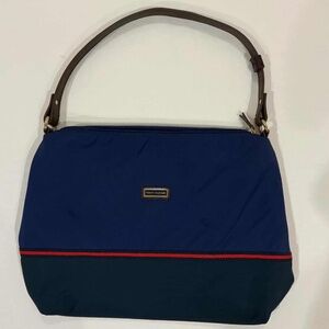 The blue shoulder bag is from the Tommy Hilfiger brand